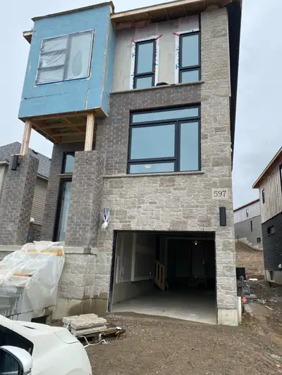 Welcome to this stunning 3+1 bedroom detached home in Kitchener. This modern residence features high...