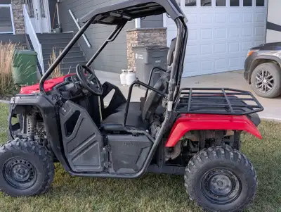 2018 Honda Pioneer 500 with 1230km. Aftermarket upgrades include roof, winch, and windshield (not sh...