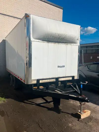 Each axle rated at 3500 lbs Heavy duty landscape trailer with box welded on top Roll-up door, floor...