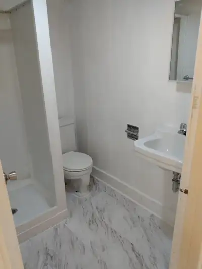 Furnished room for rent with access to private living room, kitchenette, and bathroom in basement of...