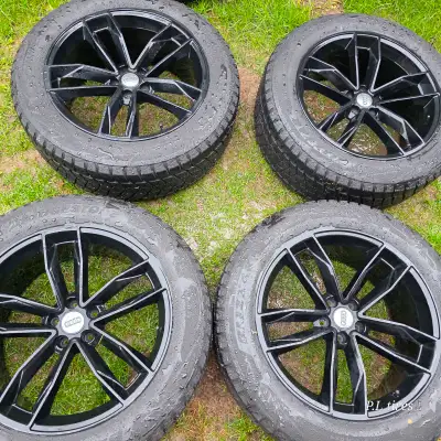 selling four 20 inch Bridgestone winter tires with alloy rims for $1200 a lot of tread remaining. ti...