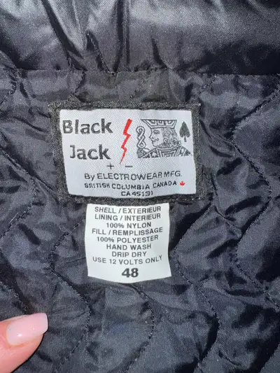New with tags. Black Jack, size 48. Headed motorcycle vest. Quick connect, plugs into battery. Detai...