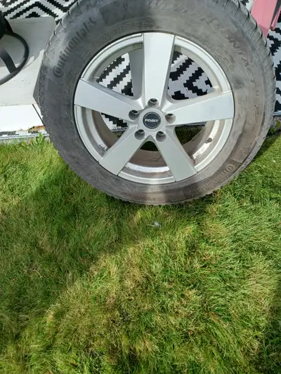 Get ready for the colder months with this set of four Continental Winter Contact tires mounted on 17...