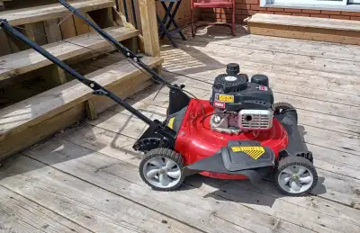 132 cc engine with easy start system. Durable 21" deck with 3 position manual height adjustment Side...