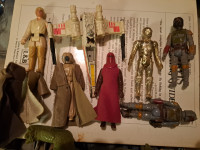 Early 80s star wars action figures,and one lizard creature.