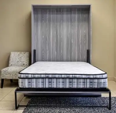 This Murphy bed is a great space-saving solution, featuring a fold-away design with a built-in desk,...