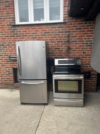 Like new stainless steel fridge and glass top stove set