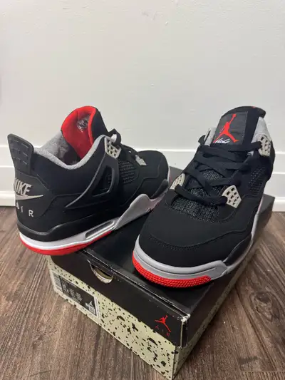 I'm selling a pair of brand new Jordan 4 Bred sneakers, available in sizes 10 and 11. These iconic s...