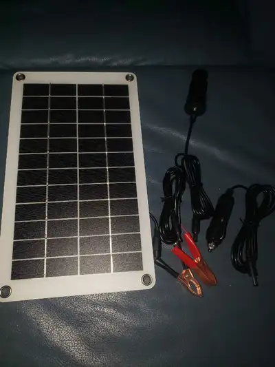 Brand new 40 w thin flexible solar pannel for rv , camping , home use. Includes direct battery clips...