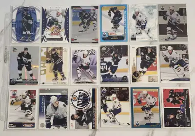 Selling 18 collectible Mike Comrie hockey cards from Oilers in good condition comes with album sleev...