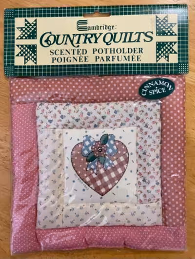 Brand new pair in factory sealed package, Cambridge Country Quilts Cinamon Spice scented potholders.