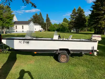 16’ wooden flat bottom boat with 30HP Johnson outboard motor (1989). Very good condition. Motor rece...