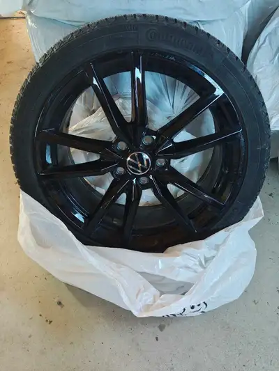 These Continental VikingContact 7 winter tires, off VW GTI/GLI, mounted on black Volkswagen alloy ri...