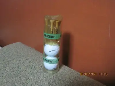 Nikken Pinacle 4 Golf Balls Special Sleeve of 2 and 6 Nikken Golf Tees - Condition is new.