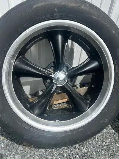 Wheels are BOSS black 5-spoke design with polished aluminum lip. Tires are Falken Raptor, size 225/6...