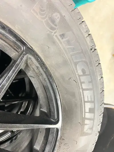 Upgrade your ride with these used Michelin 235/65R17 winter tires, featuring a reliable tread patter...