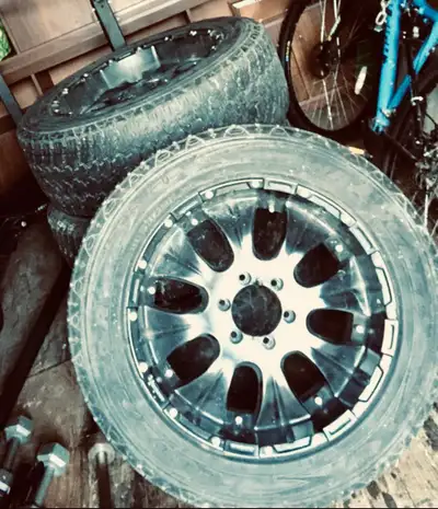 20” black rims and all season tires from a Chevy truck, 6 bolt pattern with wheel spacers , comes as...
