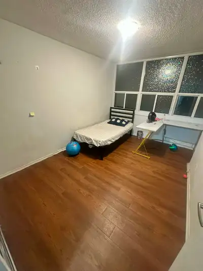One furnished bedroom available in a 3bedroom apartment. Comes with a twin bed and a L shaped table....