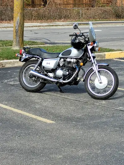 Nice, really clean 450 with solo seat. Comes with extra fuel tank and the original factory 2 person...