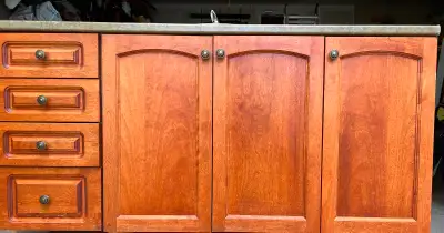 Bathroom vanity (61’x22’) with countertop and sink. Maple cabinets. Bathroom mirror (57’x36’) and li...