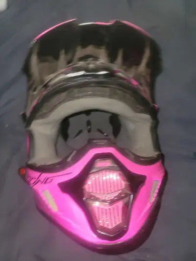 This is a FLY Racing motocross helmet in pink and black. It's in good condition and ready for some a...