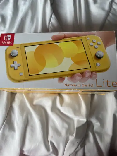 Nintendo switch lite for sale 5 days old played on it 2 times and it has Minecraft, Pokémon, super M...