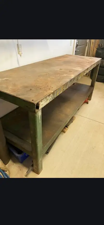 Metal Table- Extremely heavy. Might need 4 people to move it, View more