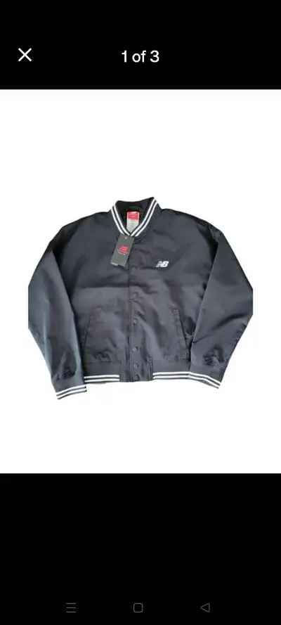 Selling a brand-new New Balance Men's Relaxed Varsity Jacket in size XL. This jacket is perfect for...