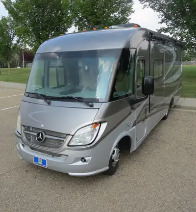 Terrific touring Class A 25' motorhome on a Mercedes Benz F50 chassis manufactured by Winnebago Indu...
