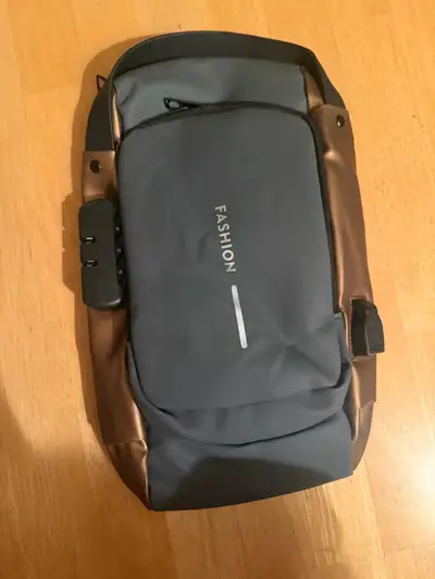 Shoulder Bag. Anti theft with lock. Adjustable strap. Pick up only. No holds. $30. Price is not nego...