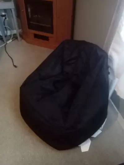 Black bean bag chair. It really hasn't been used much which is why I'm selling it. Very comfortable...