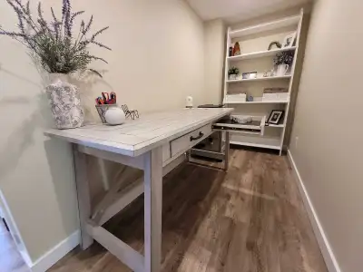 Solid wooden desk and side desk. Pickup in Cochran, Ab. Firm Price.