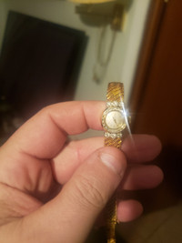 Gold omega women's watch with real diamonds