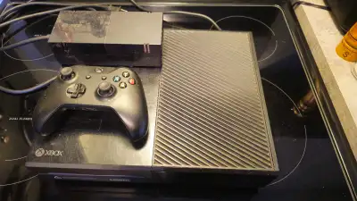 This pre-owned Microsoft Xbox One console includes the power supply and one controller, offering a g...