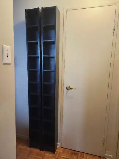Two tall book / media shelving units with adjustable shelves, View more