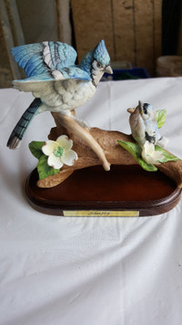 Large ceramic Blue Jay on wooden base