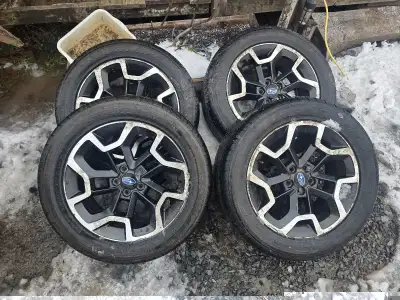 Rims/tires off a subaru crosstrek. Rims have some scale on the chrome but other wise good shape with...