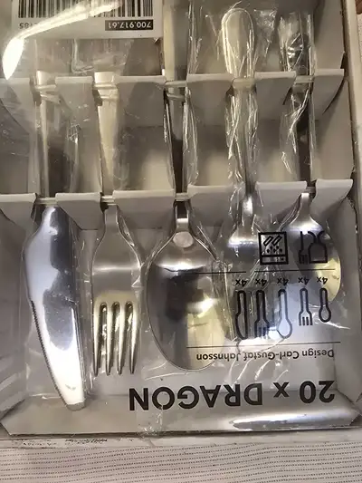 This Ikea Dragon flatware set includes service for four, with 20 pieces total, including knives, for...