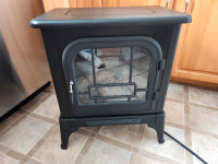 Small electric fireplace stove. Model # HE520H