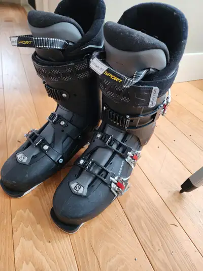 The Salomon QST Pro 90 Ski Boots in black, size 29 for men, are the perfect choice for any skiing en...