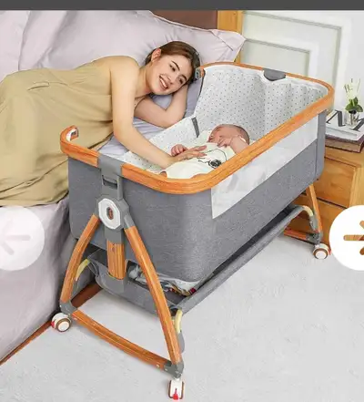 This is a new Mereyi baby bassinet, bedside sleeper that is easy to assemble and has adjustable heig...