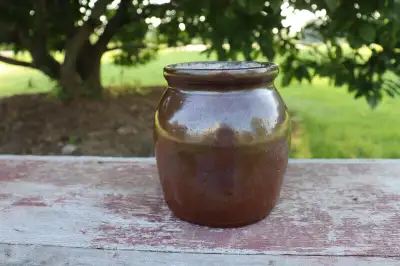 Hi. I have a small, dark brown glazed crock for sale. The crock shows some wear. There are a couple...