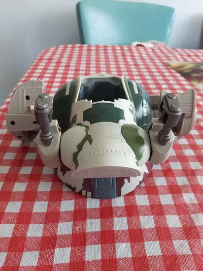 By Hasbro. Measures 8 3/4" L & 8" D. Small plastic cover missing but still a great toy with movable...