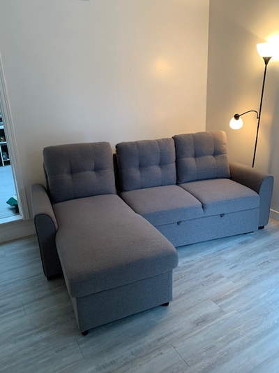 Good condition sectional sofa bed with storage, View more