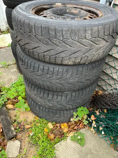 Snow tires set of 4 on steel rims Tire size 235/65/17 Lots of tire tread left on them, sold the car...