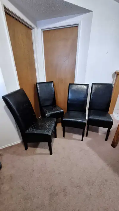 These are stylist and sturdy faux leather dining chairs with a lot of cat scratches and peeling mate...