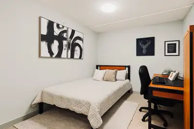 This cozy bedroom for rent in a shared 2-bedroom unit offers a comfortable living space, featuring a...
