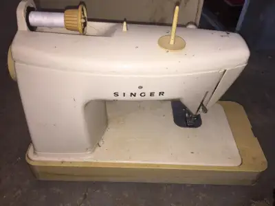 L Singer sewing machine w/ foot pedal $80. I deliver!, View more