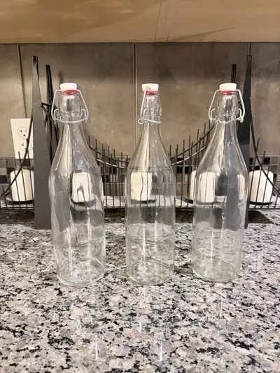 Three clean and lightly used glass swing top glass bottles. I am not sure of the exact volume but I...