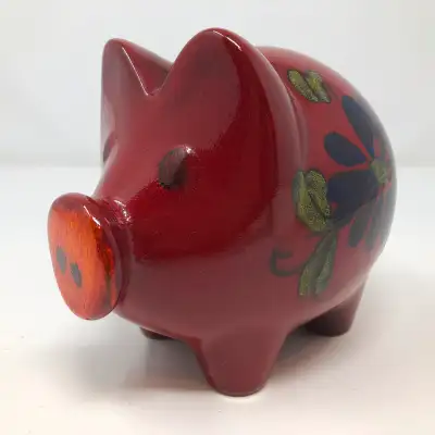Measures 6" long and 5 1/2” tall. There is a small chip near the coin slot and at the stopper hole....